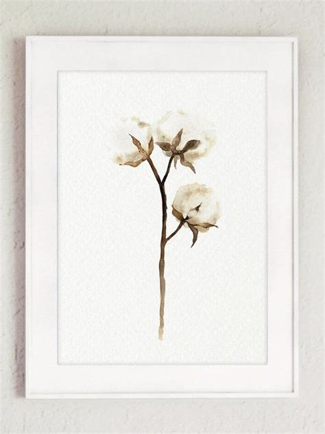 a white framed art print with three flowers on it's stem, hanging on a wall