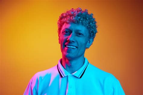 Premium Photo Portrait Of Happy Smiling Mature Man With Curly Hair