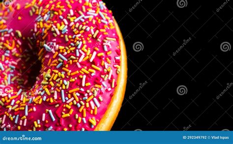 Pink Glazed Donut With Sprinkles Isolated Close Up Of Colorful Donut