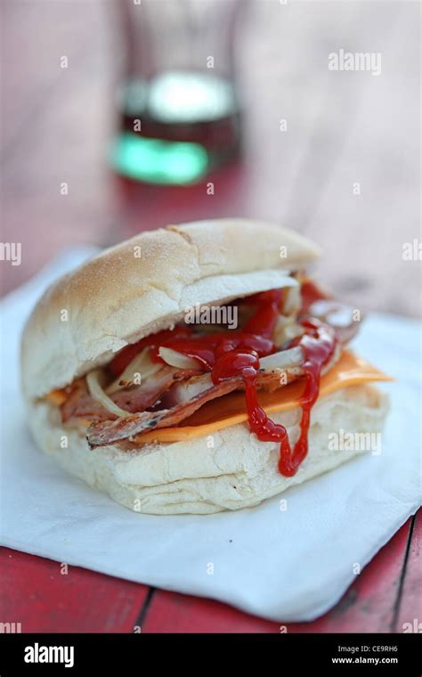 sandwich bacon barm eating on the street Stock Photo - Alamy