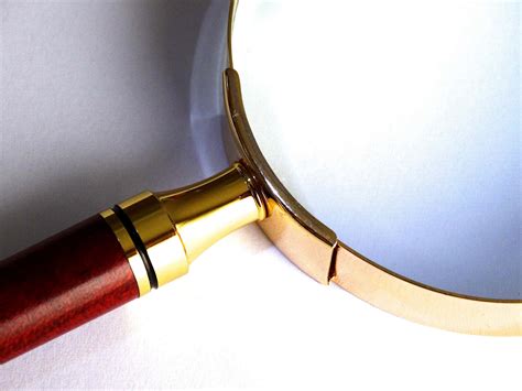 Download Magnifying Glass Quality Gold Metal Frame Wallpaper