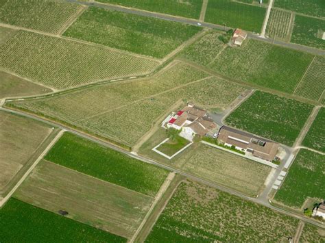 Aerial View of a Farm and Fields · Free Stock Photo