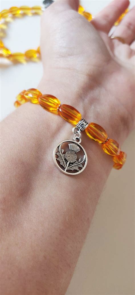 Bracelet Outlander Chardon Cossais Argent Perles Couleur Ambre Claire