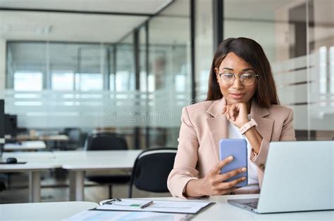 Busy African American Business Woman Working On Computer In Office