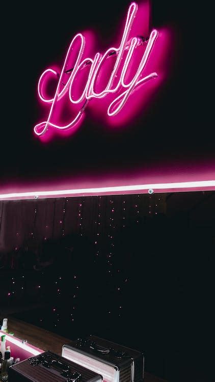 Pink Neon Sign on Black Wall · Free Stock Photo