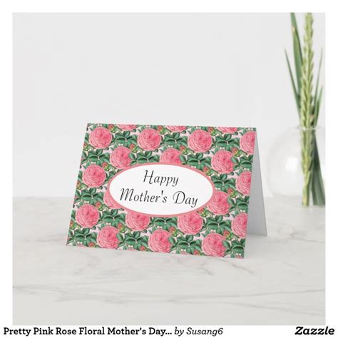 A Pink Rose Mothers Day Card On A Marble Table Next To A Potted Plant