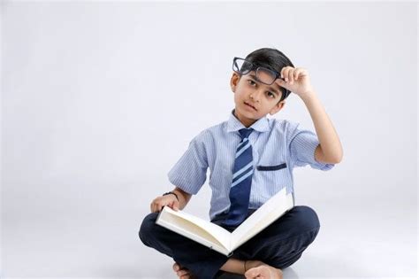 Premium Photo Cute Little Indianasian School Boy With Spectacles