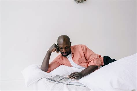 Woman Reading Book On Bed · Free Stock Photo