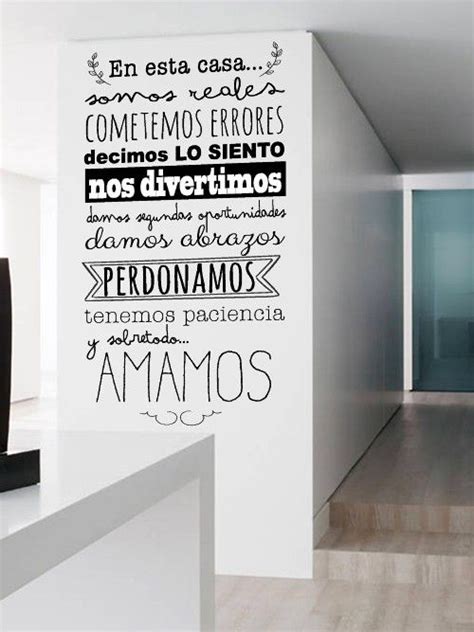 A Room With White Walls And Black Lettering On The Wall