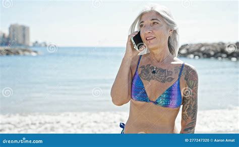 Middle Age Grey Haired Woman Tourist Wearing Bikini Talking On