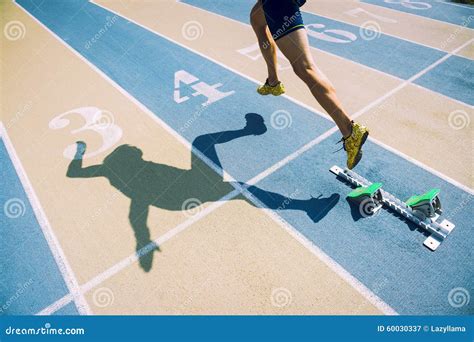 Athlete in Gold Shoes Sprinting Across Starting Line Stock Image ...