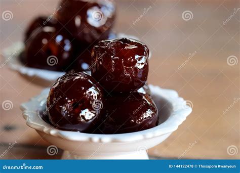 Sweet Jujube Or Chinese Red Date In Syrup In White Thai Style Cup On