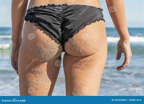 Beautiful Bikini Model Posing In A Beach Environment Stock Photo