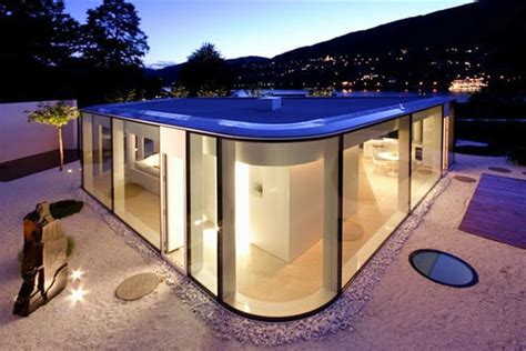 Rounded glass pavilion house on Lake Lugano