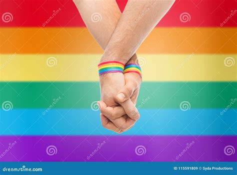 Hands Of Couple With Gay Pride Rainbow Wristbands Stock Image Image