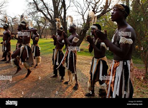 Traditional Tribal Singers Dance At Victoria Falls In Zimbabwe Stock