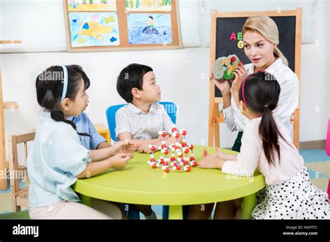 Kindergarten Children And Foreign Teacher Stock Photo Alamy