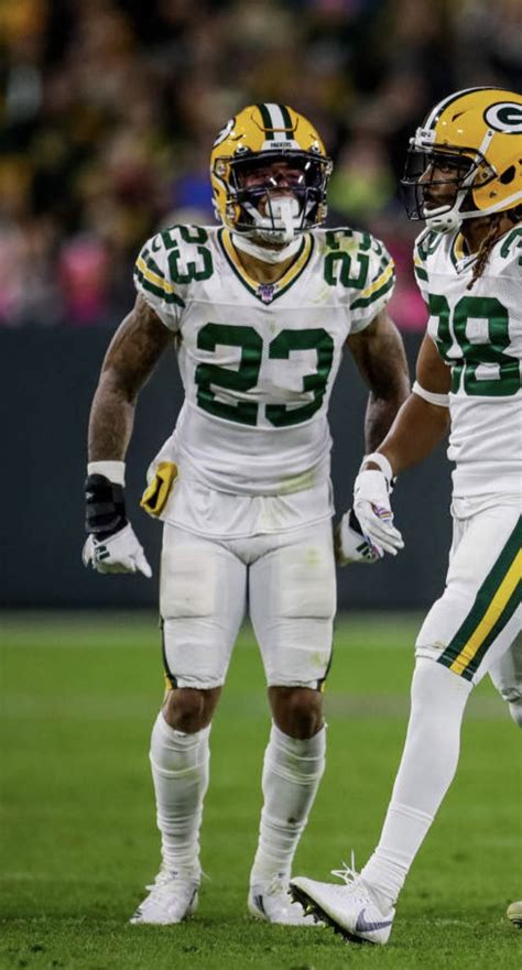 two football players are standing on the field