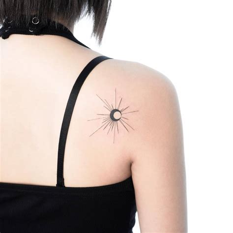 Eclipse Tattoo Done On The Shoulder Blade