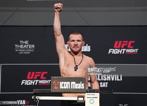 Petr Yan Of Russia Poses On The Scale During The Ufc Fight Night