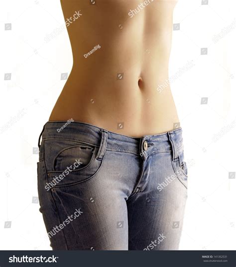 Sexy Flat Belly Of A Woman In Low Cut Skinny Blue Jeans Stock Photo