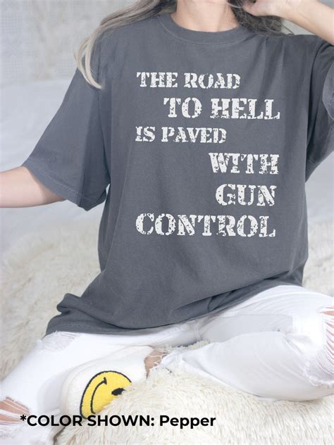 Funny Pro Gun Unisex Shirt The Road To Hell Is Paved With Gun Control