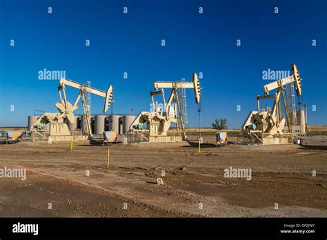 Oil Pumpers In The Bakken Play Oil Fields Near Williston North Dakota