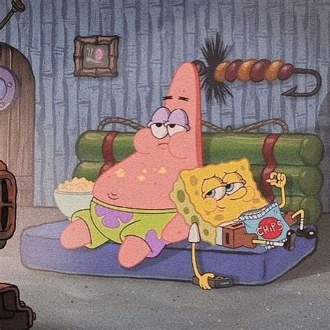 Spongebob Is Sitting On His Bed In The Living Room With Other Cartoon