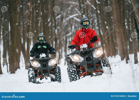 Front View. Two People are Riding ATV in the Winter Forest Stock Image ...