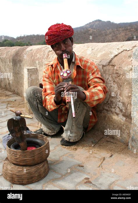 Snake charmer playing pungi in hi-res stock photography and images - Alamy