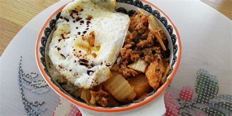 Fried Egg On A Bed Of Rice With Kimchi Stir Fried With Pork Mince Bapa Cabbage King Oyster