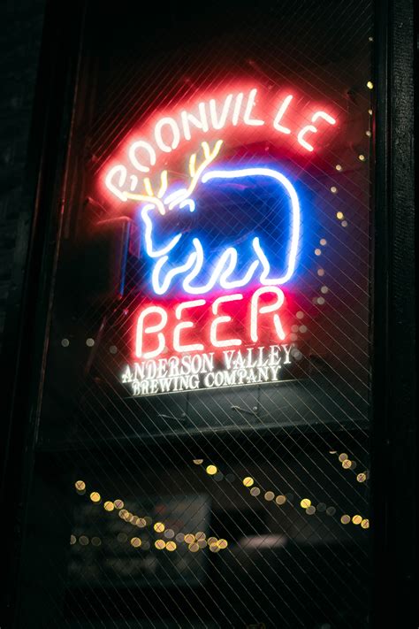 Neon Light Signages On Wall · Free Stock Photo