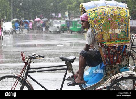 Dhaka Bangladesh 12th June 2017 A Rickshaw Puller Takes Shelter