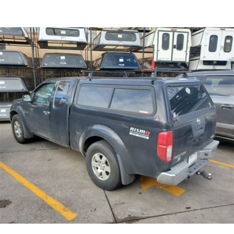 05-21-nissan-frontier-used-leer-camper-shell - Suburban Toppers