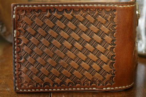 A Brown Leather Wallet Sitting On Top Of A Wooden Table