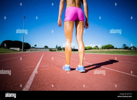 Female Athlete Standing On The Running Track Stock Photo Alamy