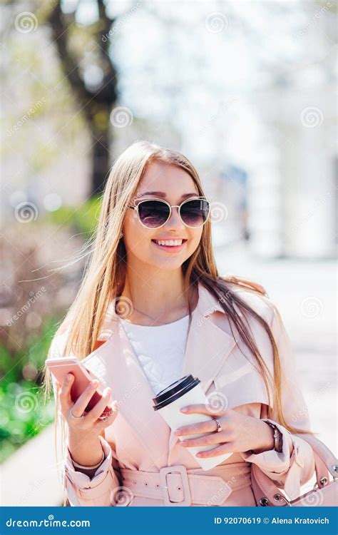 Upper Class Woman Fashionable Woman Texting Outdoors Fashion Woman In A Sunglasses And Pink