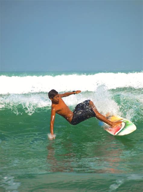 Kuta beach surfing action editorial stock image. Image of travel - 23839954