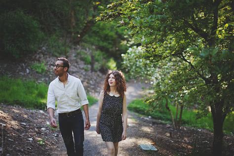 Trail Walking College Age Couple By Stocksy Contributor Kevin Russ Stocksy