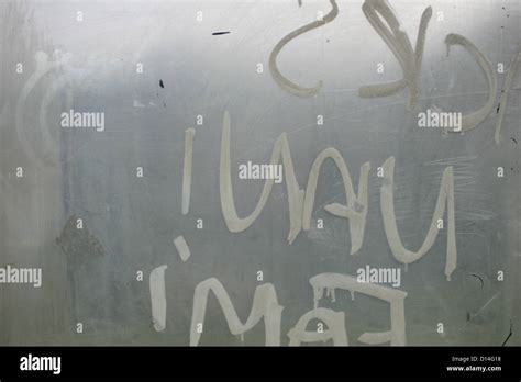 Graffiti from inside a phone booth Stock Photo - Alamy