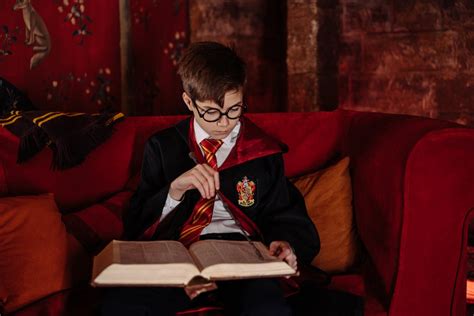 Boy Wearing Harry Potter Costume Reading a Book · Free Stock Photo