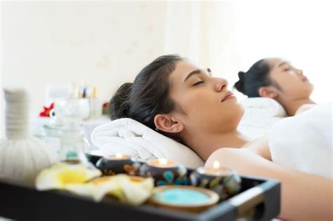 Premium Photo Woman In Bathrobe Resting On Bed