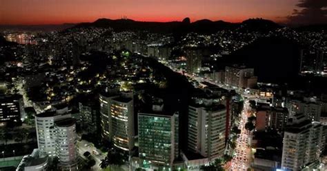 an aerial view of a city at night