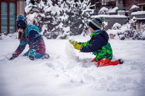 Kids playing outside in snow Stock Photos, Royalty Free Kids playing ...