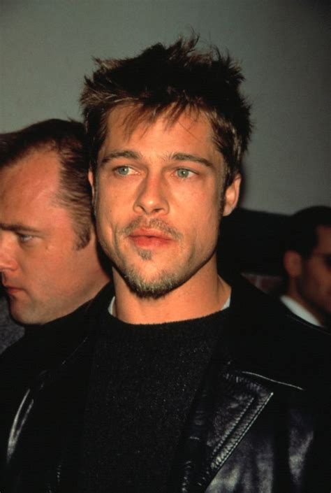 A Man With A Goatee And Leather Jacket Looking At The Camera While