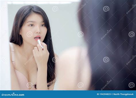 Beautiful Young Asian Woman Applying Lipstick Pink With Style Bright