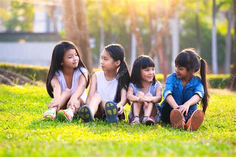 Four happy smiling child playing in park — Stock Photo © pat138241 ...