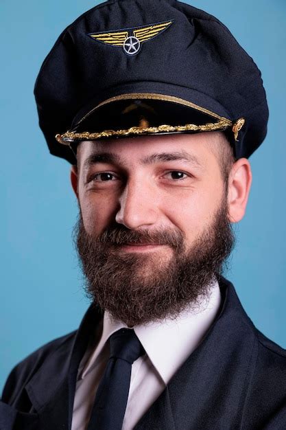 Premium Photo Aircraft Captain Wearing Uniform And Hat Portrait