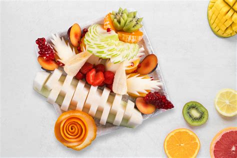 A fruit platter with sliced fruit and a slice of orange · Free Stock Photo