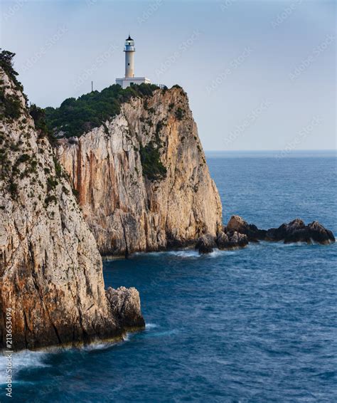 Sunset View With Magical Lighthouse Over Cape Of Doukato Lefkada